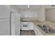 Functional kitchen featuring white appliances, ample cabinet space, and a practical layout at 3182 Tarpon Dr # 204, Las Vegas, NV 89120