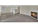 Open-concept living space with fireplace, wood floors, and seamlessly integrated kitchen at 3182 Tarpon Dr # 204, Las Vegas, NV 89120