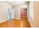 Bright bedroom with wood floors, overhead lighting, and a mirrored closet at 3257 Rushing Waters Pl, Las Vegas, NV 89135