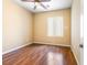 Bright bedroom with wood floors, a ceiling fan, and a window at 3257 Rushing Waters Pl, Las Vegas, NV 89135