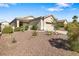 Charming single-story home featuring a two-car garage and low maintenance desert landscaping at 3257 Rushing Waters Pl, Las Vegas, NV 89135