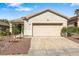 Charming single-story home featuring a two-car garage and low maintenance desert landscaping at 3257 Rushing Waters Pl, Las Vegas, NV 89135
