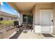 Inviting front porch with seating, providing a welcoming entrance to the home at 3257 Rushing Waters Pl, Las Vegas, NV 89135
