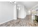 Open living space with wood-style tile flooring, neutral walls, and natural light. Ready for your personal touch at 3257 Rushing Waters Pl, Las Vegas, NV 89135
