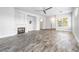 Open-concept living room featuring a fireplace, tile flooring, and lots of natural light at 3257 Rushing Waters Pl, Las Vegas, NV 89135