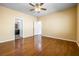 Spacious main bedroom with hardwood floors and ensuite bathroom, offering a comfortable retreat at 3257 Rushing Waters Pl, Las Vegas, NV 89135