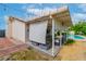 Inviting backyard with a covered patio area, lush landscaping, and a sparkling in-ground pool at 3499 Middlebury Ave, Las Vegas, NV 89121