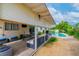 Charming backyard featuring an in-ground pool, covered patio, and well-maintained landscaping at 3499 Middlebury Ave, Las Vegas, NV 89121