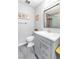 Well-lit bathroom features a gray vanity, modern fixtures, and a glass-enclosed shower at 3499 Middlebury Ave, Las Vegas, NV 89121