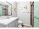 Charming bathroom with a light gray vanity, modern fixtures, and glass enclosed shower at 3499 Middlebury Ave, Las Vegas, NV 89121