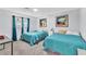 Inviting bedroom featuring two twin beds, neutral walls, and a brightly lit window at 3499 Middlebury Ave, Las Vegas, NV 89121