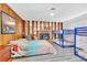 Large bedroom with a charming fireplace, multiple beds and a comfortable seating area at 3499 Middlebury Ave, Las Vegas, NV 89121