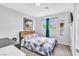 Relaxing bedroom featuring soft lighting, light gray walls, and closet with mirrored doors at 3499 Middlebury Ave, Las Vegas, NV 89121