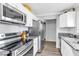 Bright kitchen featuring stainless appliances, recessed lighting and granite counters at 3499 Middlebury Ave, Las Vegas, NV 89121