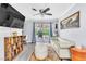 Cozy living room with contemporary flooring, decor, and sliding door access to the backyard at 3499 Middlebury Ave, Las Vegas, NV 89121