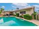 Sparkling in-ground pool with surrounding patio and view of the home's exterior, ideal for summer fun at 3499 Middlebury Ave, Las Vegas, NV 89121