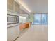 Modern kitchen featuring stainless steel appliances, sleek cabinetry, and city views through large windows at 3726 S Las Vegas Blvd # 1003, Las Vegas, NV 89158