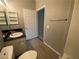 Neutral toned bathroom showcasing a single sink vanity and wood look flooring at 4730 E Craig Rd # 1149, Las Vegas, NV 89115