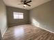 Bright bedroom features neutral walls, updated flooring, and a ceiling fan for added comfort at 4730 E Craig Rd # 1149, Las Vegas, NV 89115