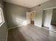 Bright bedroom with neutral walls, modern flooring, closet, and an open doorway at 4730 E Craig Rd # 1149, Las Vegas, NV 89115