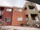 Multi-level condo building featuring stucco walls and a combination of earth-tone colors at 4730 E Craig Rd # 1149, Las Vegas, NV 89115