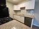 Contemporary kitchen with stainless steel appliances, granite countertops, and tile backsplash at 4730 E Craig Rd # 1149, Las Vegas, NV 89115
