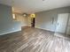 Open-concept living area with a ceiling fan, wood floors, and modern paint at 4730 E Craig Rd # 1149, Las Vegas, NV 89115