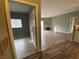 View of a spacious living space with modern flooring, fireplace, and access to other rooms at 4730 E Craig Rd # 1149, Las Vegas, NV 89115
