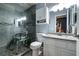 This bathroom has a tiled shower with a shower chair at 5025 Chambliss Dr, Las Vegas, NV 89130