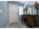 This entryway has a white door and an accent table at 5025 Chambliss Dr, Las Vegas, NV 89130