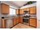 This charming kitchen offers stainless steel appliances and lots of cabinet space at 5025 Chambliss Dr, Las Vegas, NV 89130