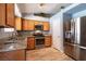 This kitchen offers stainless steel appliances and granite countertops at 5025 Chambliss Dr, Las Vegas, NV 89130