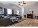 Cozy living room with stylish decor, fireplace, vaulted ceiling, and wood-look floors at 5025 Chambliss Dr, Las Vegas, NV 89130