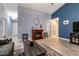 Open-concept living room featuring a fireplace, wood-look floors, and contemporary furnishings at 5025 Chambliss Dr, Las Vegas, NV 89130