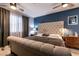 This main bedroom features a large upholstered headboard, and recessed lighting at 5025 Chambliss Dr, Las Vegas, NV 89130