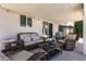 Relaxing covered patio featuring comfortable wicker furniture and ambient string lights at 5025 Chambliss Dr, Las Vegas, NV 89130
