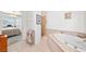Bright bathroom featuring a soaking tub and a separate walk-in shower at 5060 Wheatland Dr, Pahrump, NV 89061