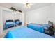 Bedroom featuring two beds with a closet and decor on top at 5060 Wheatland Dr, Pahrump, NV 89061