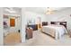 Spacious bedroom with walk-in closet and natural light features carpet and a ceiling fan, creating a peaceful retreat at 5060 Wheatland Dr, Pahrump, NV 89061