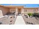 Close-up view of the home's entrance, highlighting the front porch, pillars, and walkway leading to the front door at 5060 Wheatland Dr, Pahrump, NV 89061
