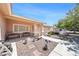 Inviting front porch with stone landscaping, seating, and a walkway leading to the front door of the home at 5060 Wheatland Dr, Pahrump, NV 89061