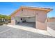 A detached garage with an open door highlights the generous size for parking and storage at 5060 Wheatland Dr, Pahrump, NV 89061