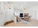 Comfortable living room with a stone fireplace, neutral walls, tile floors, and ample seating for relaxing at 5060 Wheatland Dr, Pahrump, NV 89061