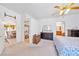 Bright main bedroom with walk-in closet access, ceiling fan and bathroom entrance, enhancing comfort and convenience at 5060 Wheatland Dr, Pahrump, NV 89061