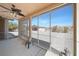 Sunroom with large screened windows, ceiling fan, and access to the backyard at 5060 Wheatland Dr, Pahrump, NV 89061
