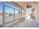 Relaxing sunroom with screens to enjoy the outside views and a ceiling fan at 5060 Wheatland Dr, Pahrump, NV 89061