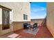 Red rock backyard features seating area and doorway at 5200 Paradise Skies Ave, Las Vegas, NV 89156