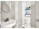 Modern half bathroom featuring a stylish vessel sink, updated fixtures, and a decorative mirror at 5200 Paradise Skies Ave, Las Vegas, NV 89156