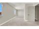 Bright, neutral bedroom featuring two windows and soft carpet flooring at 5200 Paradise Skies Ave, Las Vegas, NV 89156