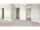 Bedroom featuring ensuite bath and neutral carpet and paint at 5200 Paradise Skies Ave, Las Vegas, NV 89156